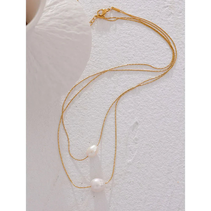 Collar de acero inoxidable y perlas